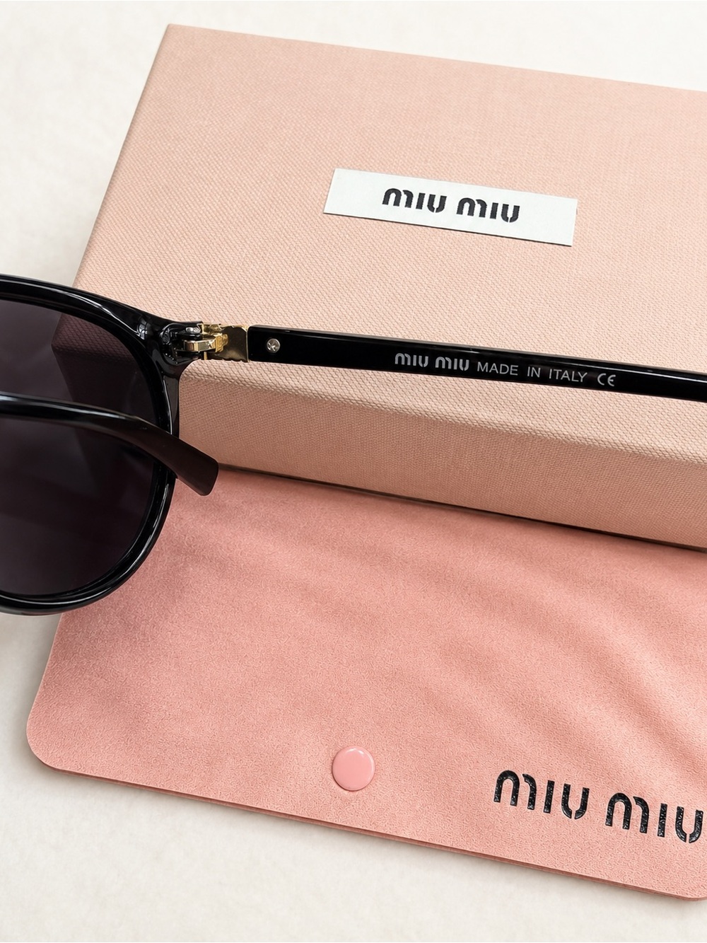 Miu Miu Black Oval Sunglasses - Picture 2 of 3